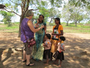 giving parfume to the two nursery teachers